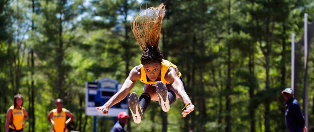Ƶ student athlete performing in long-jump