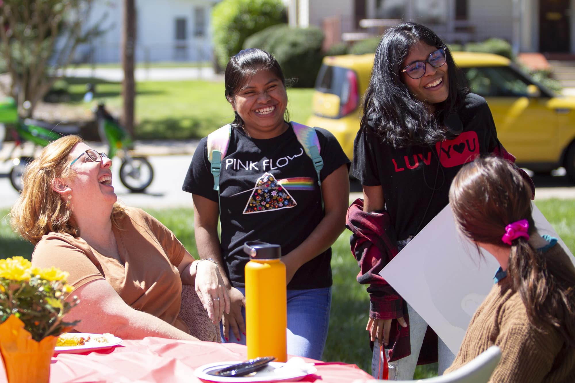 Two international students laugh at a picnic celebrating Ƶ's International Friendship Program